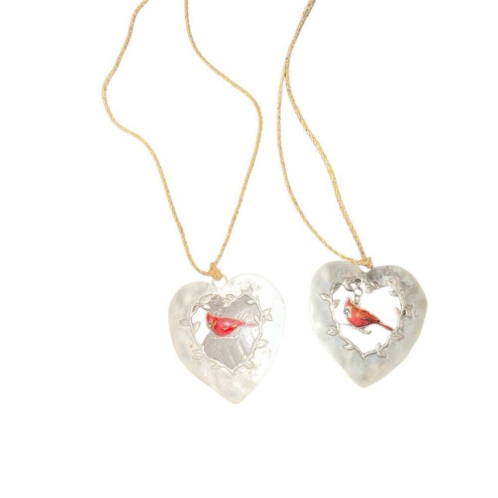 2 decorative silver hearts with cardinal pendant